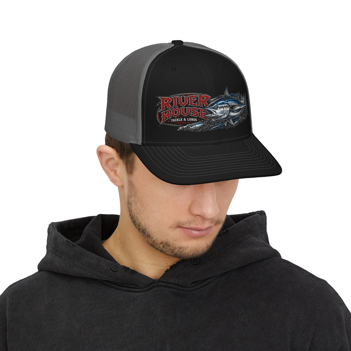 Model wearing the black and gray River House Albacore Tuna trucker hat, front view