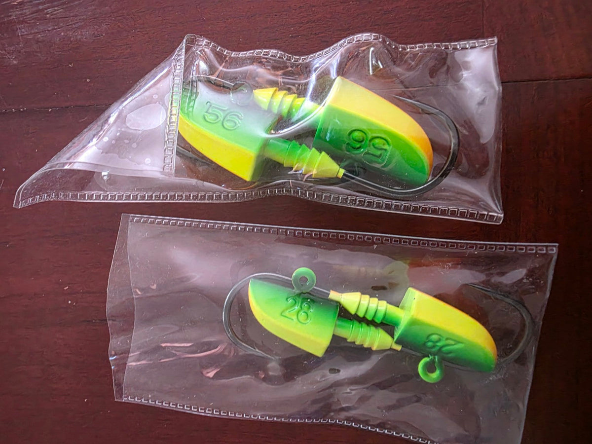 Green and yellow lead jig heads in 1 ounce and 2 ounce two-piece packs