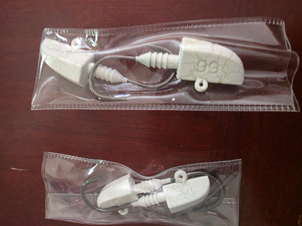 White crackle lead jig heads in 1 ounce and 2 ounce two-piece packs