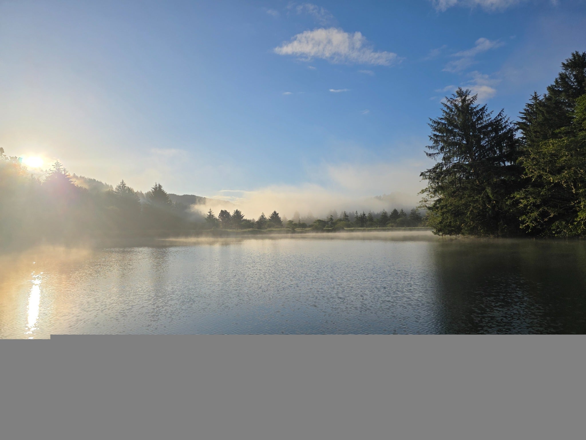 Fog lifting over Oregon Coast water